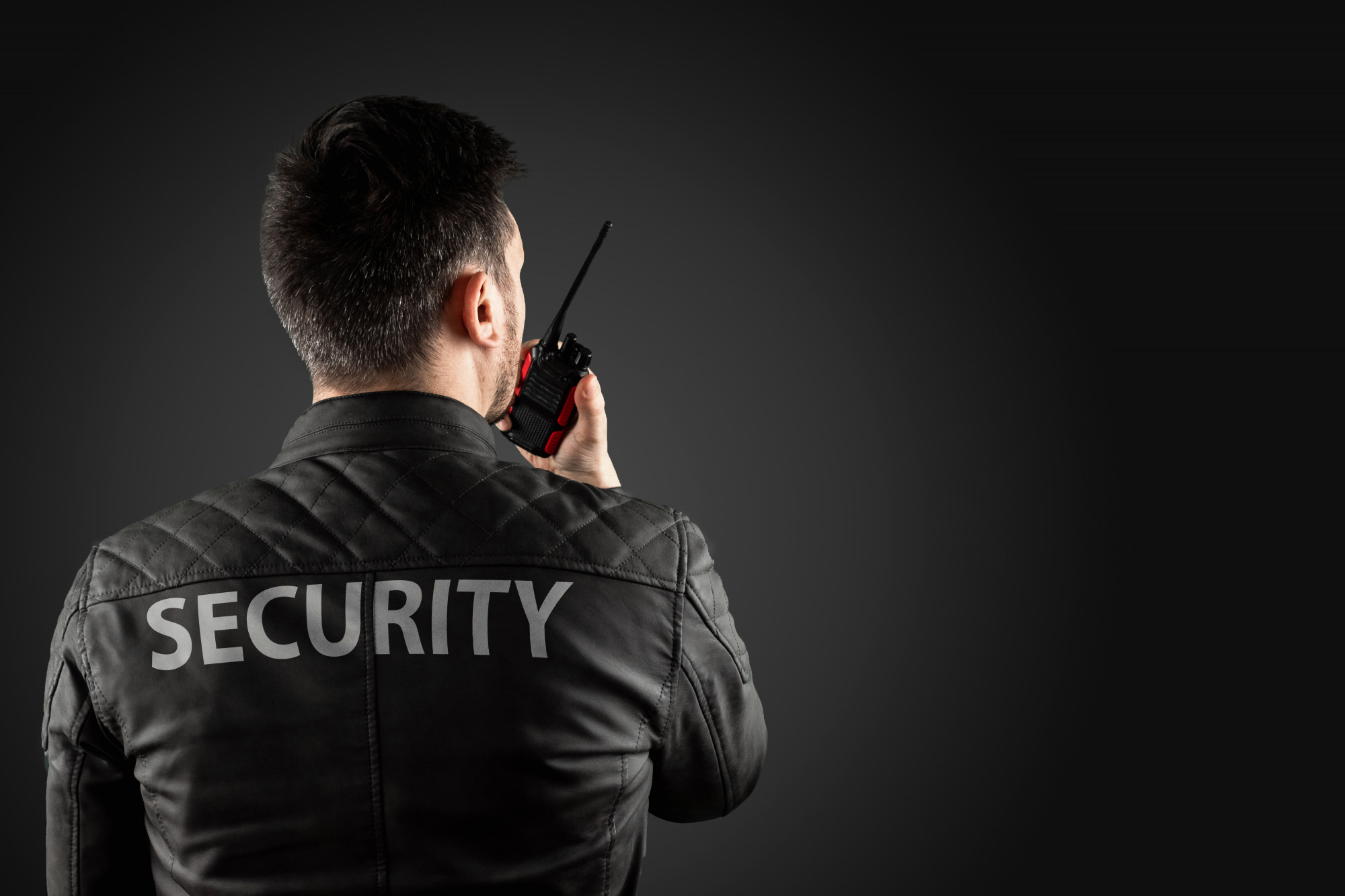 man-security-is-holding-walkie-talkie